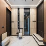 A contemporary office with sleek marble floors and elegant wood paneling.