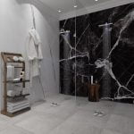 A bathroom with elegant marble walls and flooring, featuring a porcelain slab.